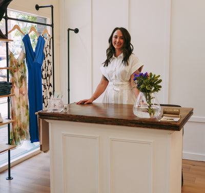 Jenna, founder of Style Curated, in the boutique in Old Town Fort Collins