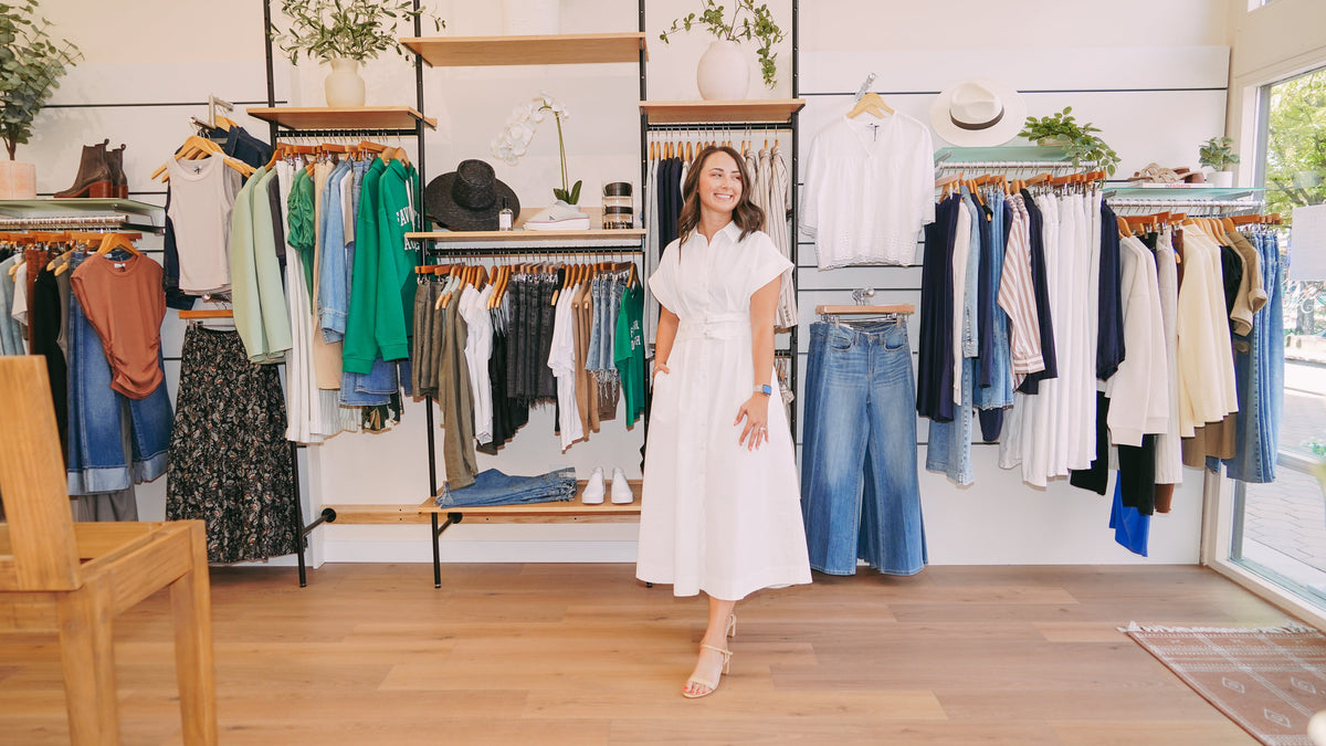 Jenna standing among the racks at Style Curated in Old Town Fort Collins