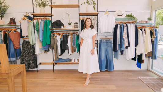 Jenna standing among the racks at Style Curated in Old Town Fort Collins