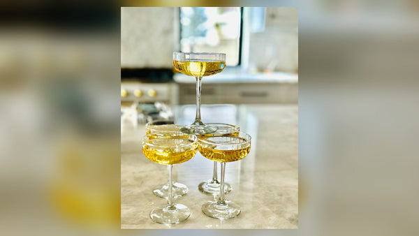 Champagne coupes ready for a private after-hours styling party at Style Curated in Old Town Fort Collins